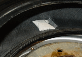Install inside the tire opposite the valve stem