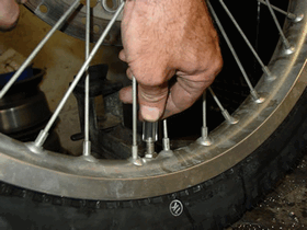 Thread the hose onto the valve stem