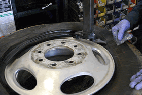 Top tire bead over the rim